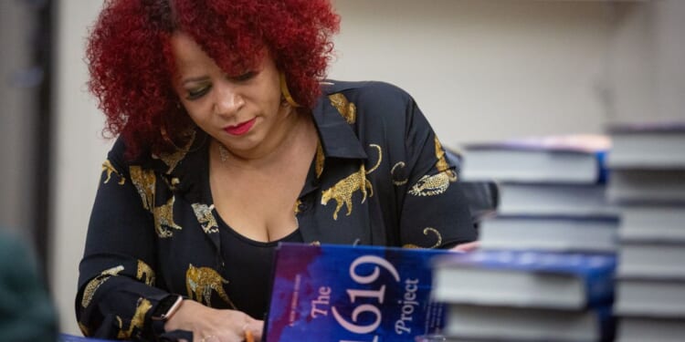Pulitzer Prize-winning leftist journalist Nikole Hannah-Jones signs copies of her book "The 1619 Project" in Los Angeles on Nov. 30, 2021.