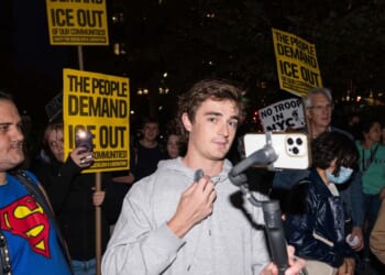 Conservative influencer Nick Shirley films protestors demonstrating against U.S. Immigration and Customs Enforcement arrests on Oct. 22, 2025, in New York City.