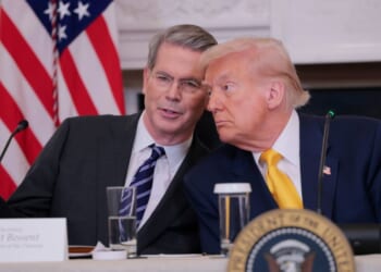 Treasury Secretary Scott Bessent and President Donald Trump look on during the White House Digital Assets Summit in the State Dining Room of the White House on March 7, 2025, in Washington, D.C.