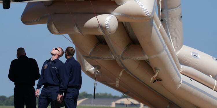 Air Force One's inflatable slide temporarily delays Trump's departure for GOP soiree in Texas
