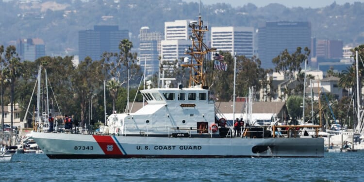 Personnel stand aboard the U.S. Coast Guard coastal patrol boat Tern as it maneuvers though the harbor in the Marina Del Rey community of Los Angeles county, on May 13, 2026.