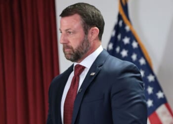 Secretary of Homeland Security Markwayne Mullin stands silently during a press conference at the U.S. Citizenship and Immigration Services New York field office on Sept. 1, 2026, in New York City.