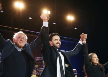 New York Mayor Zohran Mamdani celebrates with Sen. Bernie Sanders and Rep. Alexandria Ocasio-Cortez during an election rally on Oct. 26, 2025, at Forest Hills Stadium in the Queens borough of New York City.