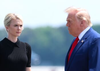 Secretary of War Pete Hegseth, executive assistant to President Donald Trump Natalie Harp, and President Donald Trump attend a dignified transfer at Dover Air Force Base on July 22, 2026, in Dover, Delaware.
