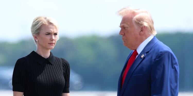 Secretary of War Pete Hegseth, executive assistant to President Donald Trump Natalie Harp, and President Donald Trump attend a dignified transfer at Dover Air Force Base on July 22, 2026, in Dover, Delaware.