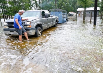 Edouard, now a tropical depression, drenches Texas with flash flooding and downed trees