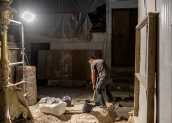 A worker carries out renovations at the Church of the Holy Sepulchre in the old city of Jerusalem on Aug. 4, 2026.
