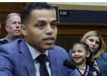 Marcus Coleman, father of Dalilah Coleman, seen sitting behind him, who was permanently disabled after an illegal alien caused a multi-car crash, testifies as his wife Ileana Krause, right, listens during a hearing before the Subcommittee on Immigration Integrity, Security, and Enforcement of the House Judiciary Committee Tuesday in Washington, D.C.