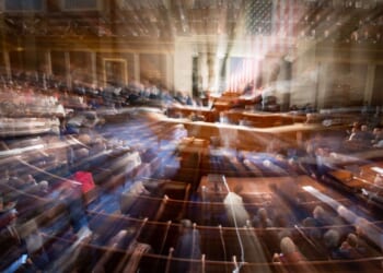 In a slow-shutter exposure, members of Congress congregate on the floor of the House Chamber of the U.S. Capitol Building in Washington, D.C., in a 2023 file photo.