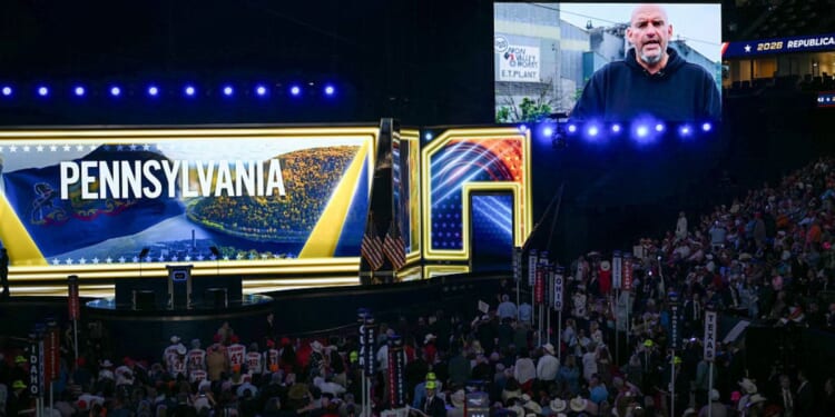 Sen. John Fetterman, a Pennsylvania Democrat, is seen on a screen as he delivers a video message Wednesday during the Republican National Midterm Convention at the American Airlines Center in Dallas, Texas.