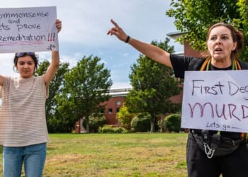 Demonstrators call for a first-degree murder verdict Tuesday as they protest outside the courthouse during the jury deliberation phase of Lindsay Clancy's murder trial at the Plymouth County Superior Court in Plymouth, Massachusetts.