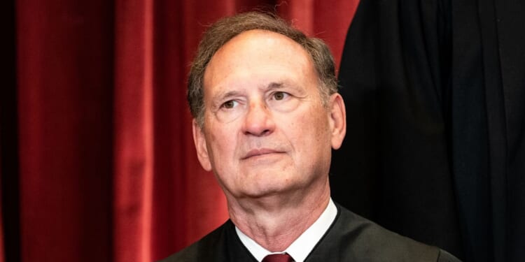 Associate Justice Samuel Alito sits during a group photo of the Justices at the Supreme Court in Washington, D.C., on April 23, 2021.