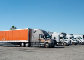 Truckers with semitrucks park in a rest area in Buttonwillow, California, on June 26, 2026.