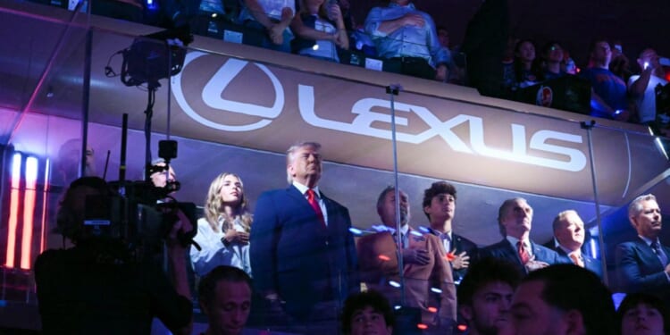 President Donald Trump with his granddaughter Kai Trump, Knicks owner James Dolan, Secretary of the Interior Doug Burgum, and Environmental Protection Agency director Lee Zeldin attend Game Three of the NBA Finals between the San Antonio Spurs and the New York Knicks at Madison Square Garden in New York on June 8, 2026.