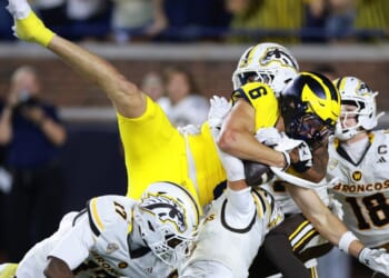 JJ Buchanan of the Michigan Wolverines catches a game winning pass with no time left on the clock to beat the Western Michigan Broncos 13 to 12 at Michigan Stadium on Sept. 5, 2026, in Ann Arbor, Michigan.