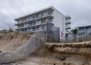 Fences and sand dunes lay in ruin along Ocean City Beach on Sept. 28, 2026, in Ocean City, Maryland.