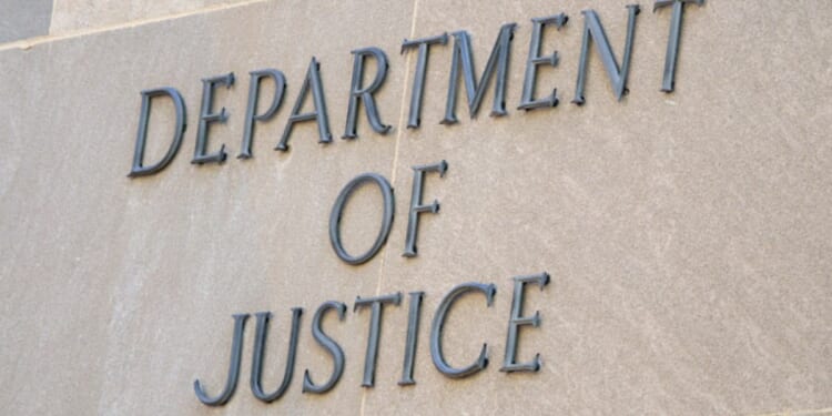The Department of Justice logo can be viewed on the side of the Justice Department Headquarters in Washington, D.C. on August 8, 2026.