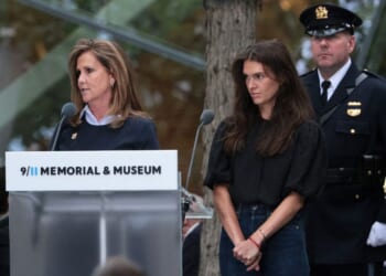 Terry Strada, left, widow of Tom Strada, reads the names of loved ones lost during a ceremony commemorating the 25th anniversary of the Sept. 11 terrorist attacks on the World Trade Center at the National 9/11 Memorial & Museum in New York City.
