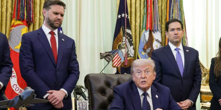 President Donald Trump is flanked by Vice President J.D. Vance, left, and Secretary of State Marco Rubio, right, during an April meeting in the Oval Office of the White House in Washington, D.C.