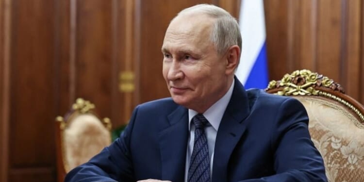 Vladimir Putin, Russian President, sits in a gilded room in Moscow during a meeting with the head of the Federal Customs Service on September 21, 2026.