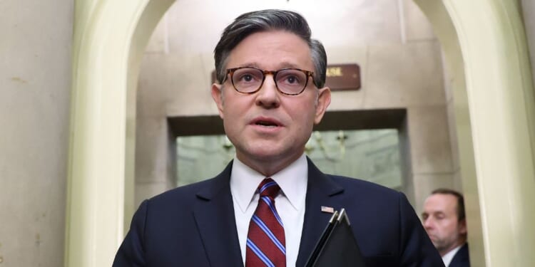 Speaker of the House Mike Johnson adjusts his glasses as he speaks to reporters outside of his office at the U.S. Capitol on Sept. 16, 2026, in Washington, D.C.