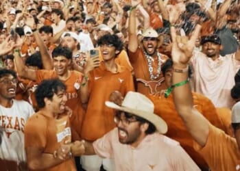 Texas students celebrate during the Texas Longhorns game in Austin, Texas, on Sept. 12, 2026.
