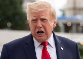 President Donald Trump, seen in a Saturday photo, called the Axios story a "hoax" and urged the political news outlet to retract it.