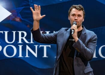 Conservative political activist Charlie Kirk is seen in a file photo from Oct. 17, 2024, speaking at a meeting on the campus of the University of Arizona in Tucson.