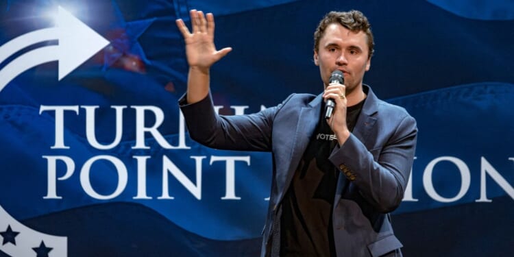 Conservative political activist Charlie Kirk is seen in a file photo from Oct. 17, 2024, speaking at a meeting on the campus of the University of Arizona in Tucson.