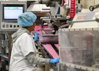 A factory worker is pictured in a 2025 file photo from The Pez Factory in Orange, Connecticut.