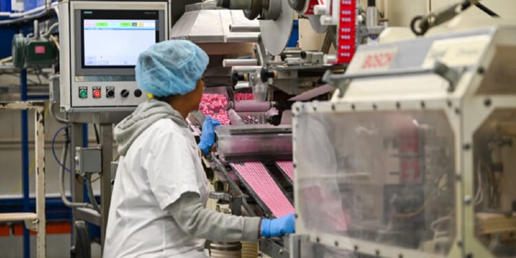A factory worker is pictured in a 2025 file photo from The Pez Factory in Orange, Connecticut.