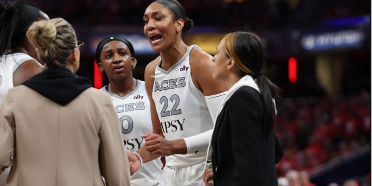 A'ja Wilson #22 of the Las Vegas Aces is visibly upset after entering the stands to confront a fan Tuesday during game two of the first round of the WNBA Playoffs against the Indiana Fever at Gainbridge Fieldhouse in Indianapolis, Indiana.