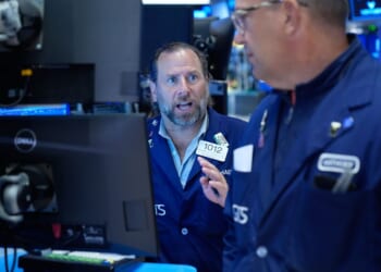 Wall Street holds near its record after Brent oil briefly falls below $98 per barrel