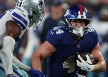 Cam Skattebo of the New York Giants runs the ball during the fourth quarter against the Dallas Cowboys at MetLife Stadium on Sept. 13, 2026, in East Rutherford, New Jersey.