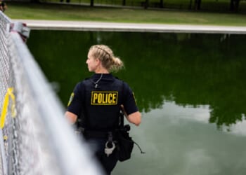 Police patrol the Lincoln Memorial Reflecting Pool in a June file photo during a controversy over vandalism at the pool aimed at embarrassing President Donald Trump.