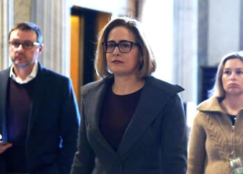 Sen. Kyrsten Sinema arrives at the Senate chamber for a live quorum call at the U.S. Capitol on Feb. 12, 2024, in Washington, D.C.