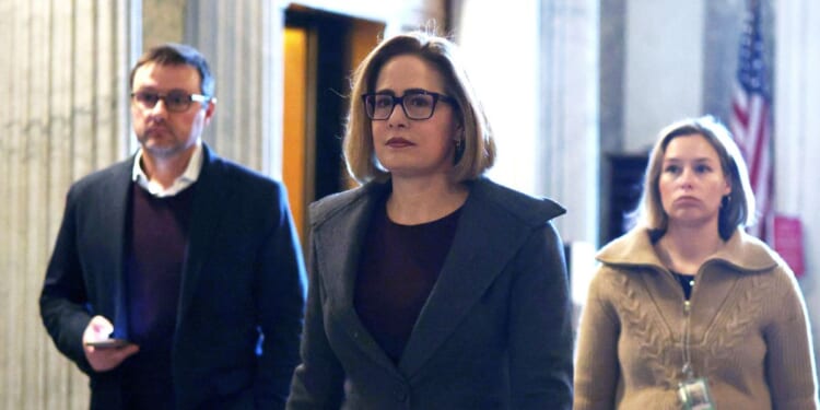 Sen. Kyrsten Sinema arrives at the Senate chamber for a live quorum call at the U.S. Capitol on Feb. 12, 2024, in Washington, D.C.