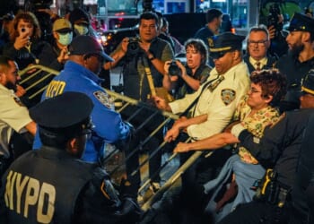 Protesters clash with NYPD officers after a man was shot by an Immigration and Customs Enforcement officer during an operation in the Bronx, on Oct. 8, 2026, in New York City.