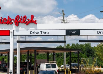 Cars are seen in the order lines on opening day at the first elevated Chik-Fil-A on Aug. 22, 2024, in McDonough, Georgia.