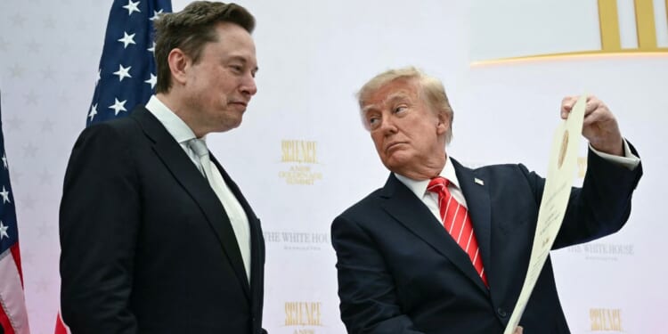 President Donald Trump presents the National Medal of Science to Elon Musk during the "Golden Age of American Innovation Summit" at the Institute of Peace in Washington, D.C., on Oct. 8, 2026.
