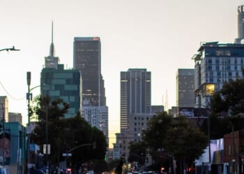 A homeless man walks on the street in Skid Row on July 25, 2025, in downtown Los Angeles, California.