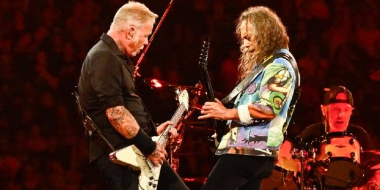 James Hetfield of Metallica, left, pictured jamming with lead guitarist Kirk Hammett in an August 2024 performance at Gillette Stadium in Foxborough, Massachusetts.