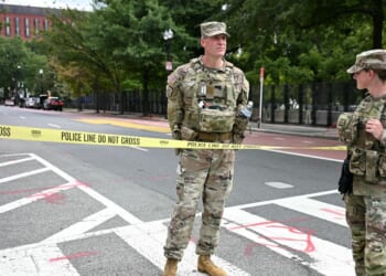 U.S. National Guard members stand by a police line after a car crashed into a barricade near the White House in Washington, D.C., on Sept. 19, 2026.