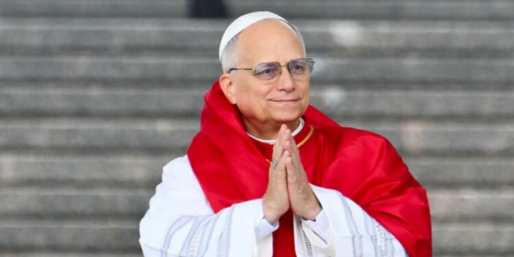 Pope Leo XIV gestures during a visit at the Maqam Echahid Martyrs' Monument in El Madania, near Algiers, on April 13, 2026.