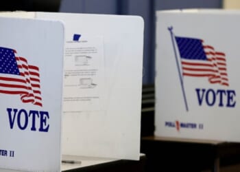 The voting booths stand on a table.