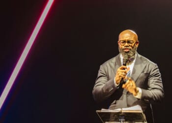 Pastor John Amanchukwu leads the daily prayer at Turning Point's AmericaFest conference, in remembrance of late right-wing political activist Charlie Kirk, in Phoenix, Arizona, on Dec. 18, 2025.