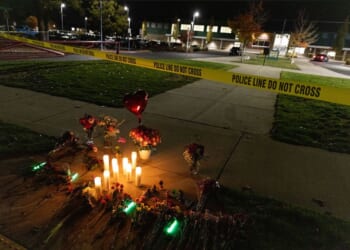 Candles and flowers are seen at a makeshift memorial outside the Silver Rail Elementary School following a mass shooting Thursday in Bend, Oregon.