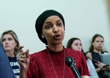 Rep. Ilhan Omar speaks to reporters in the hallway outside a House Committee on Education and the Workforce hearing "Columbia in Crisis: Columbia University's Response to Anti-Semitism" at Capitol Hill in Washington, D.C., on April 17, 2024.