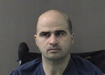In this photo released by the Bell County Sheriff's Office, U.S. Maj. Nidal Hasan, the Army psychiatrist who is charged with murder in the Fort Hood shootings, is seen in a booking photo after being moved to the Bell County Jail on April 9, 2010, in Belton, Texas.