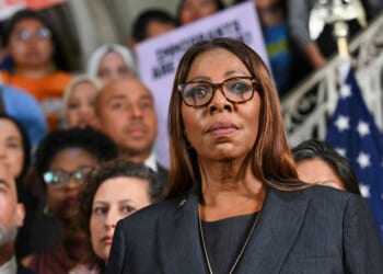 New York Attorney General Letitia James looks on as New York City Mayor Zohran Mamdani speaks during a news conference to announce a lawsuit challenging the federal government's new public charge rule, which could make it harder for immigrants to obtain green cards if they rely on public benefits, at City Hall in New York City on Sept. 14, 2026.